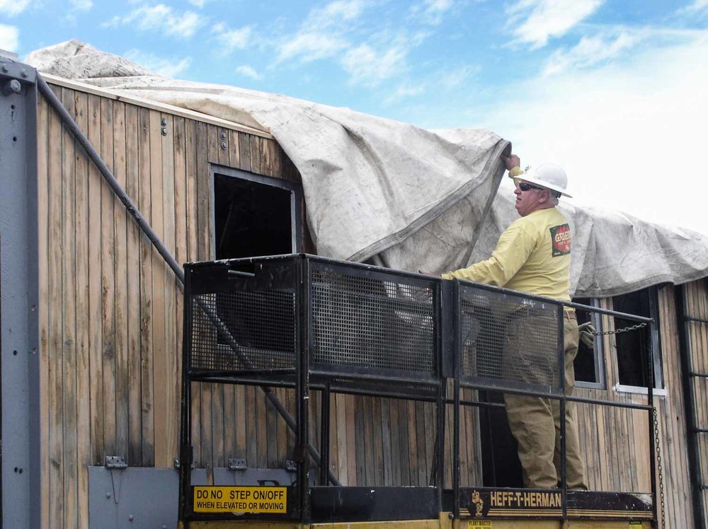 2019.09.23 Using a man lift to get to the tarp on OY (1 of 1).jpg