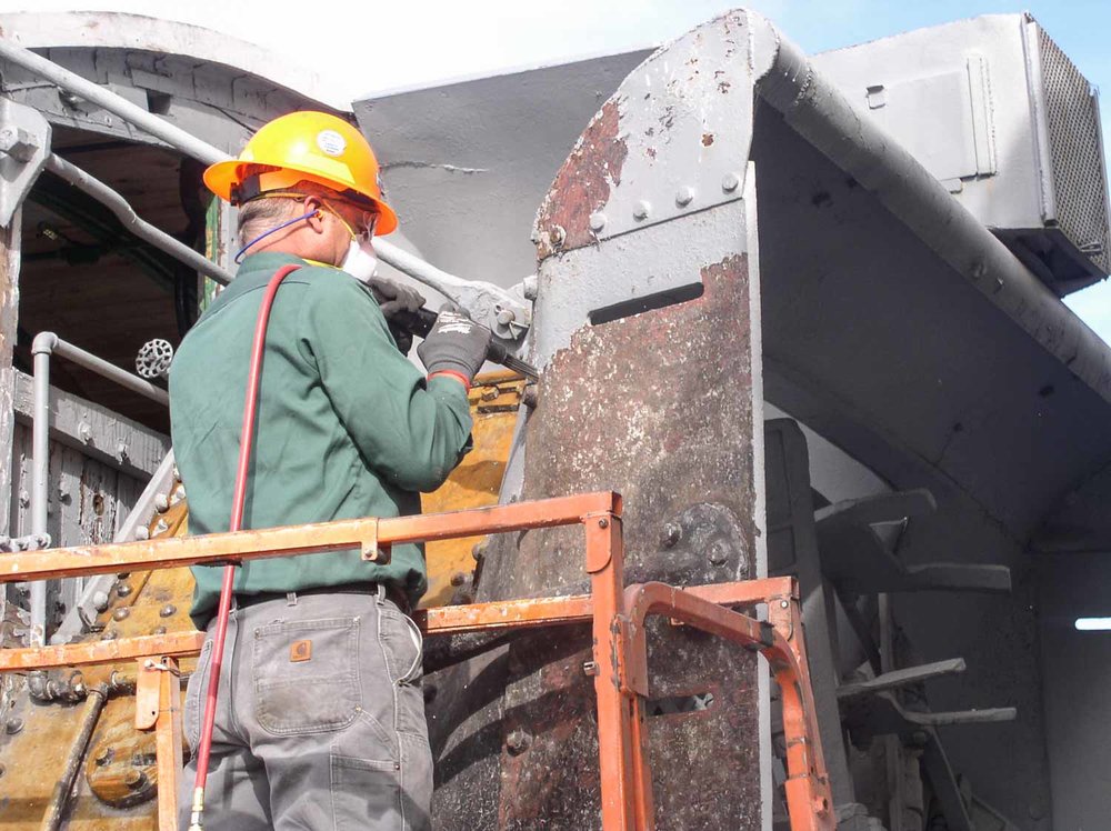 2019.09.26 oy Another shot of the needle scaler being used to remove paint on OY (1 of 1).jpg