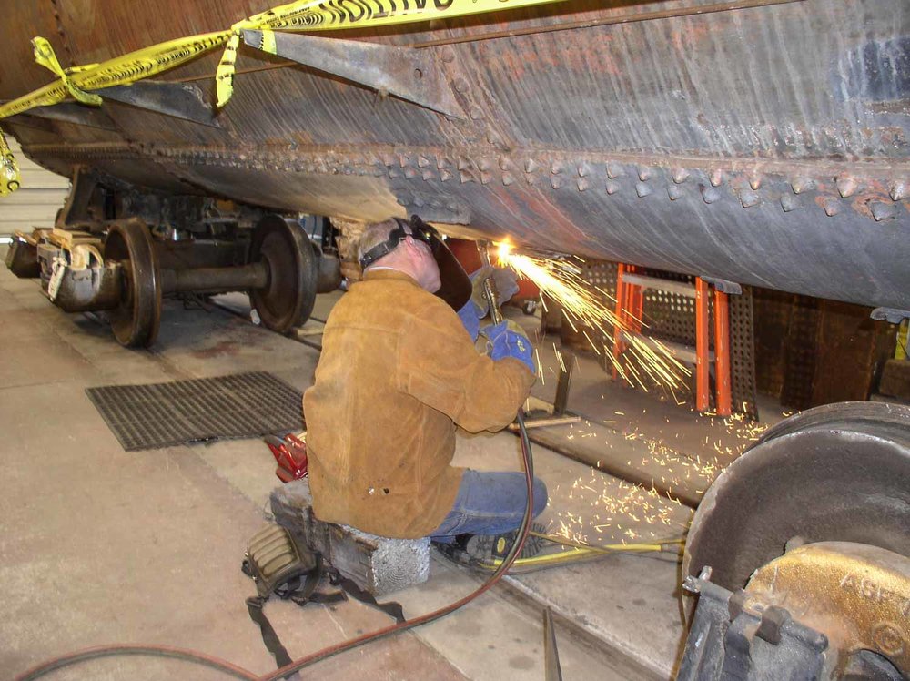 2019.09.26 tc Cutting something off the underside of the Gramps tank car (1 of 1).jpg