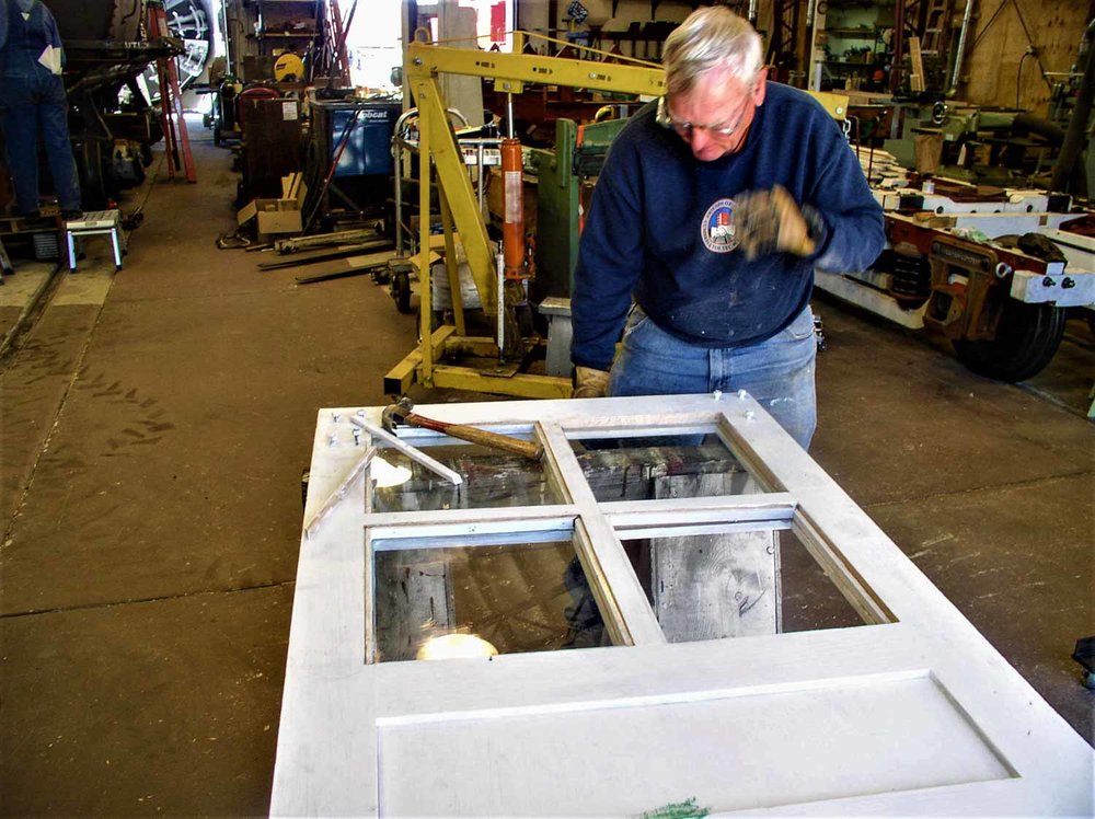 2019.09.25 oy Working on the framing of the windows in one of the OY doors (1 of 1).jpg