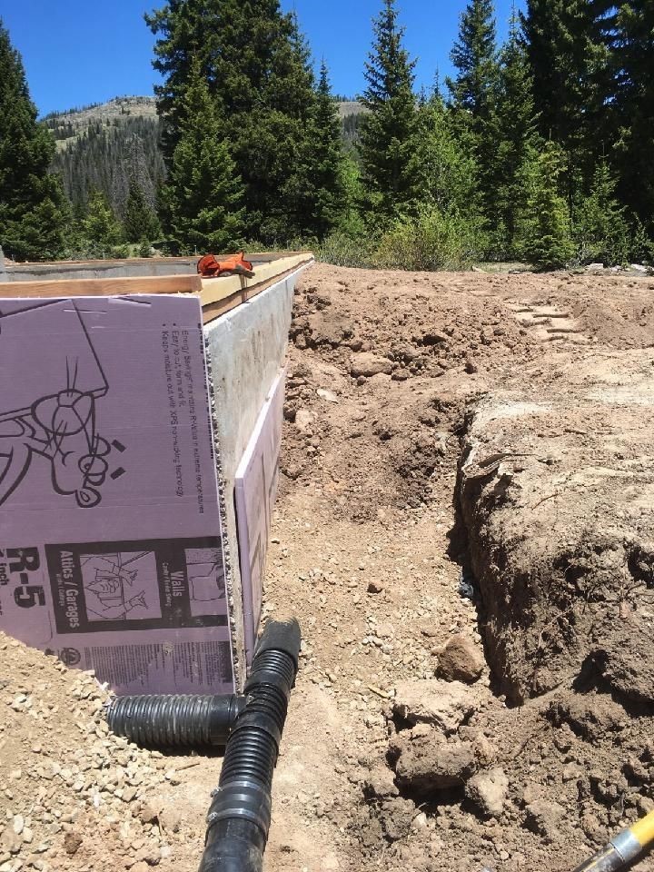 5 Looking at the sides of the footings with the insulation and drain pipe.jpg