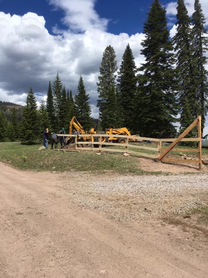 10 Crew working on the fench around the house.jpg