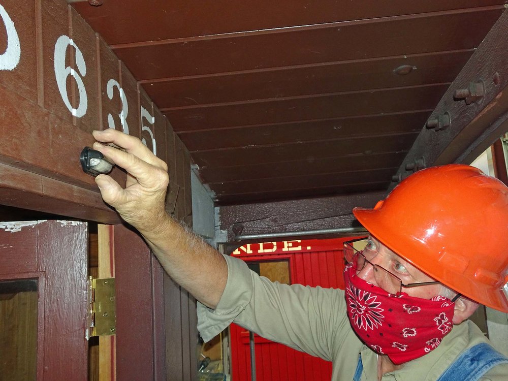 Attaching a light above one of the doors on 05365.jpg