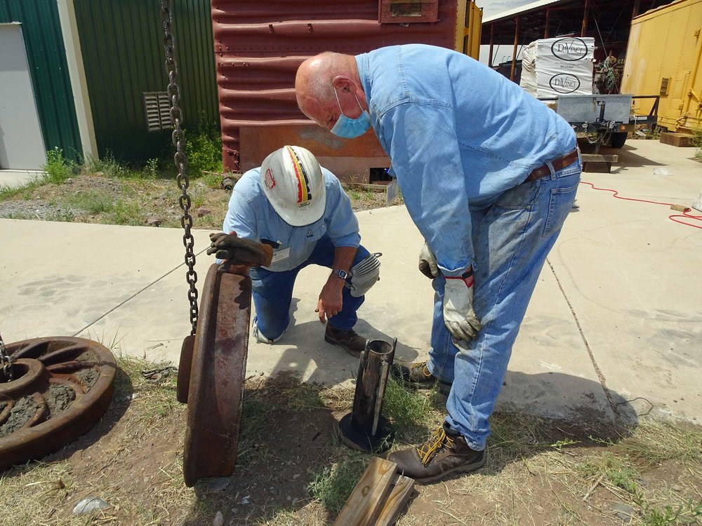 The wheel press crew is eying a ram and has a wheel to compare to.jpg