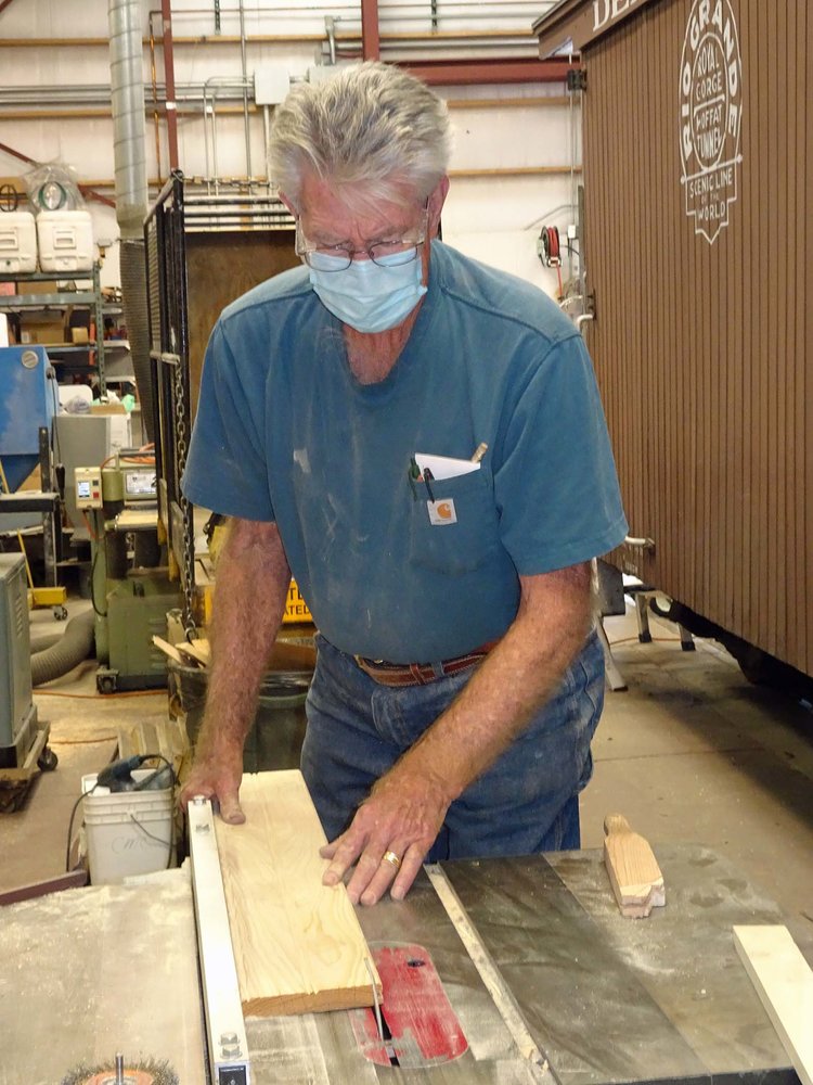 Getting some boards cut to size for rebuilding work on the caboose.jpg