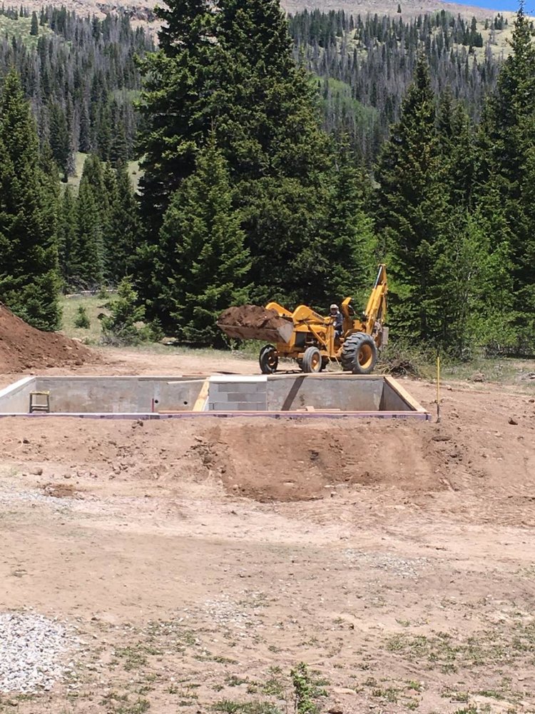 The foundation is being backfilled after the work was done on insulation and drainage.jpg