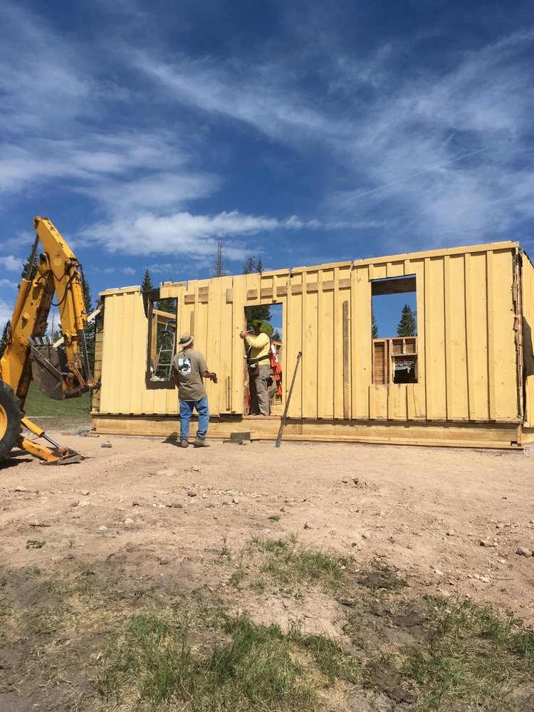 Working on framing in the door to the house.jpg