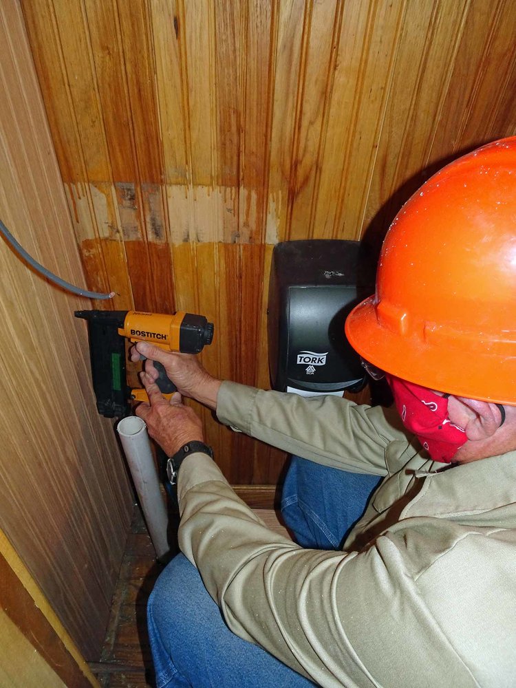 Attaching siding into the new caboose bathroom.jpg
