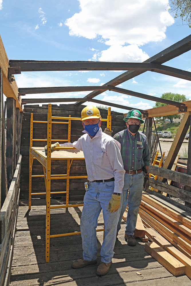 2 Two of the Chama crew by the scholl as they work on the rebuild.jpg