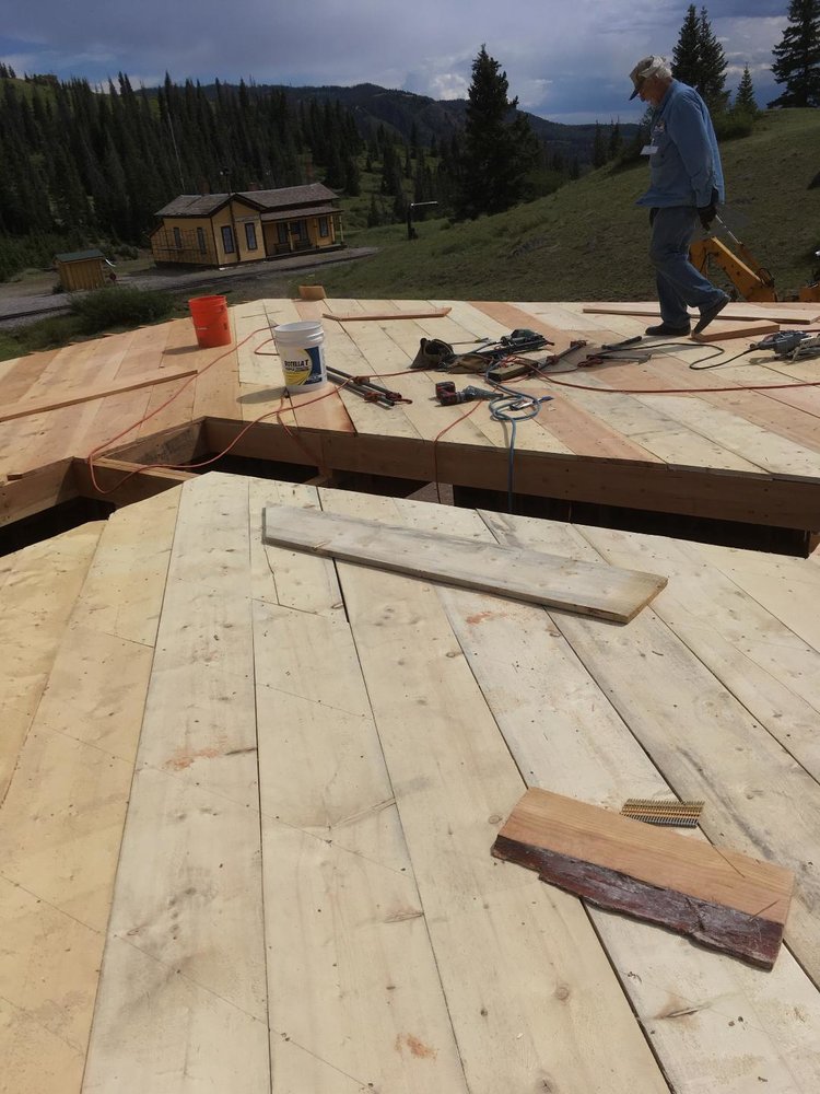 The floor to the second story takes shape with the section house in the background.jpg
