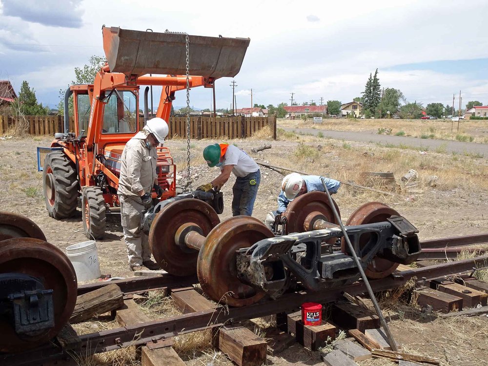 The side frame for this truck is being set into place.jpg