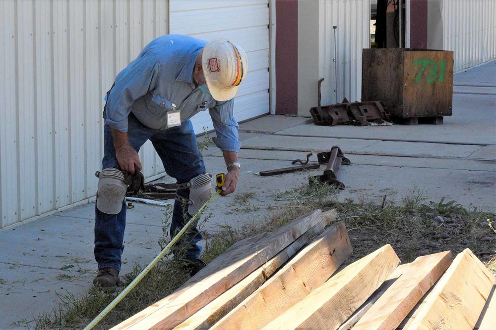 Checking the length of a board to be used_ (1 of 1).jpg