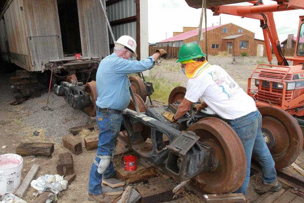 One Friend is directing the loader as it lowers the top plate (1 of 1).jpg