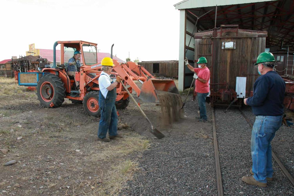 The loader is dumping dirt to help with the cleanup (1 of 1).jpg