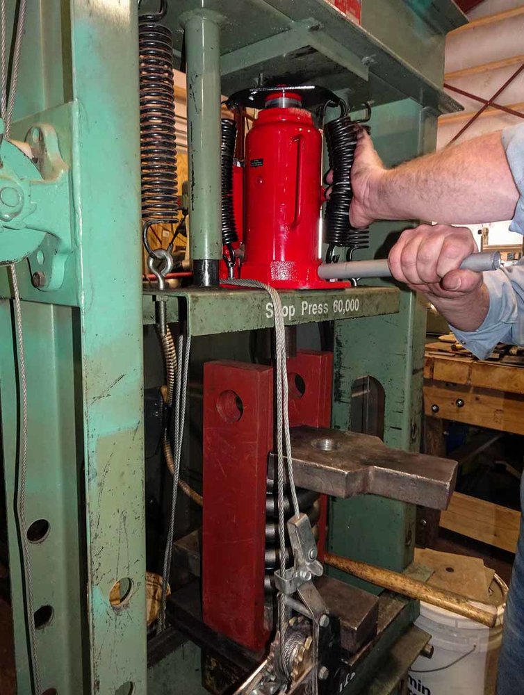 Using the shop press to compress the springs before installing (1 of 1).jpg