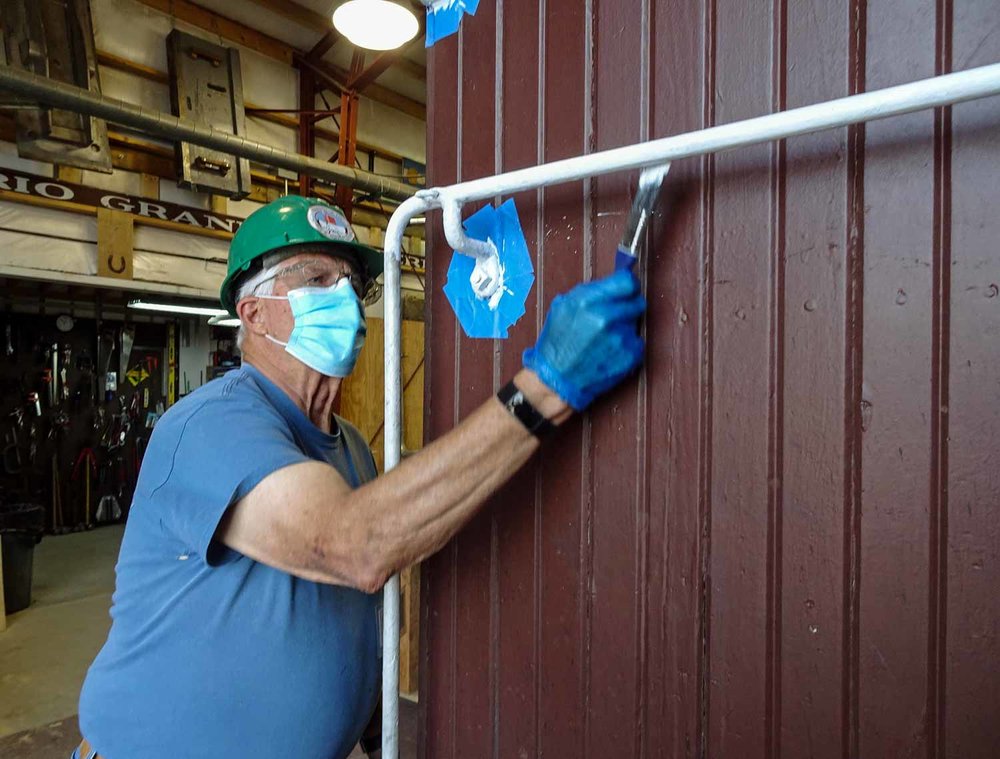 Painting the railing on caboose 5635 (1 of 1).jpg