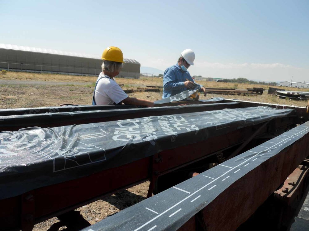 A protective material is placed on the metal of 6214 before the planking is placed (1 of 1).jpg