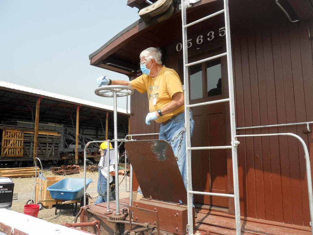 The brake wheel on caboose 5635 gets new white paint (1 of 1).jpg