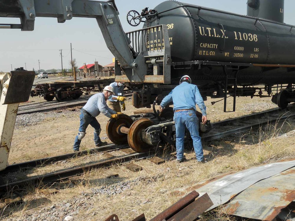 z With the cribbing removed the new truck is rolled under the tank car (1 of 1).jpg