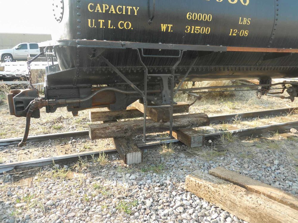 The tank car sitting on its cribbing as it waits the new truck (1 of 1).jpg