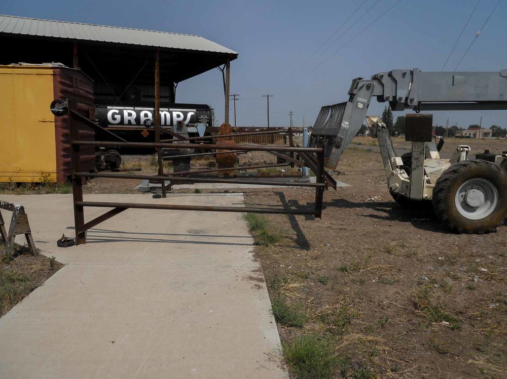 The heavy forklift is moving a rack of some kind (1 of 1).jpg