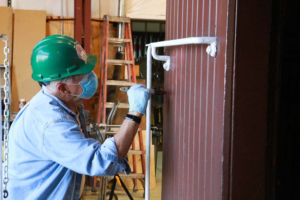 Touching up the end of a caboose (1 of 1).jpg