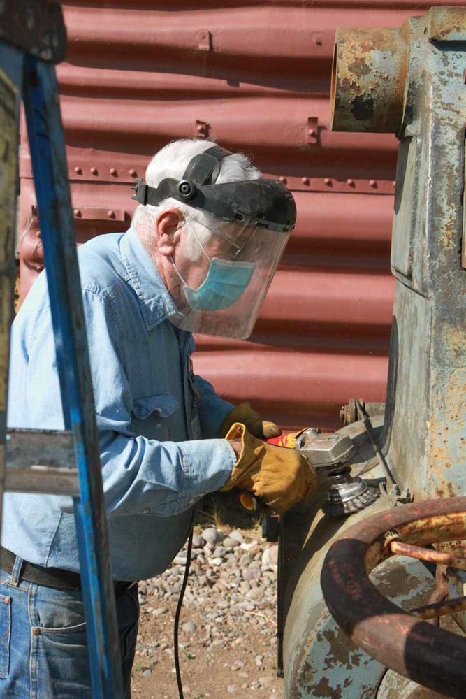 Using the wire brush to remove rust from the wheel press (1 of 1).jpg