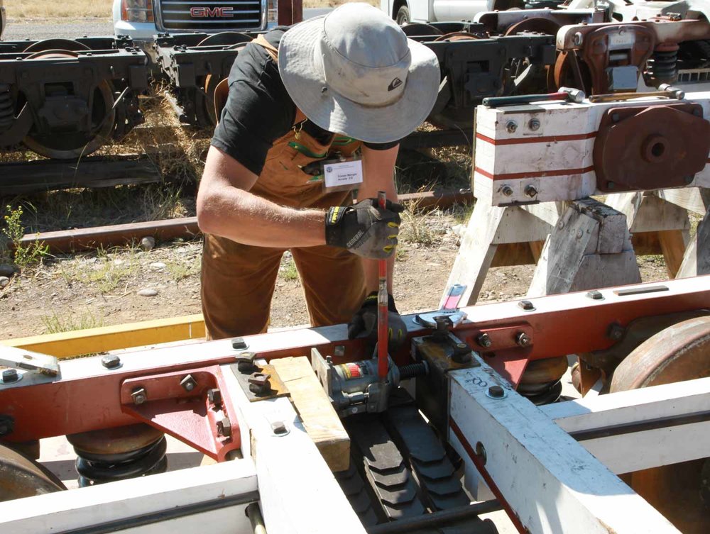 Using the hand press to move the boards far enough apart to get the assemble into the space (1 of 1).jpg