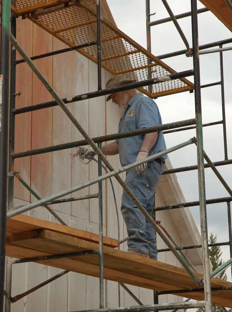 The paint sprayer is at work at the primer coat goes on the Car Inspectors house (1 of 1).jpg