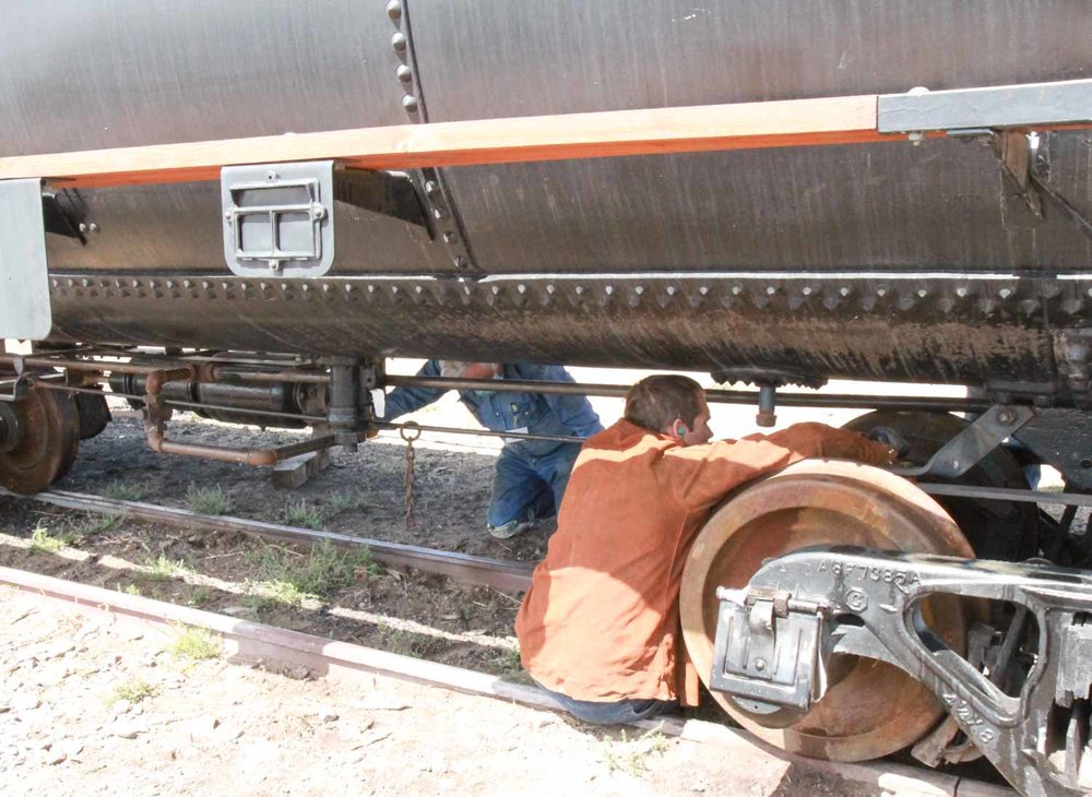 Working on the brake rigging of the Union tank car (1 of 1).jpg