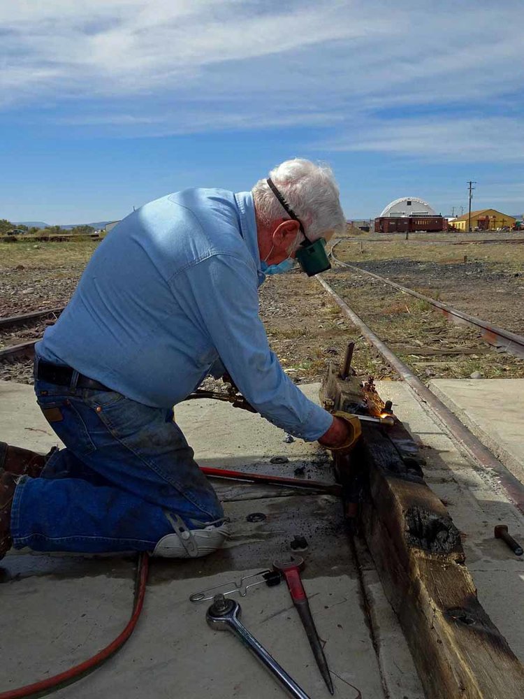 Cutting a bolt head off the old beam from the idler car 9569 (1 of 1).jpg