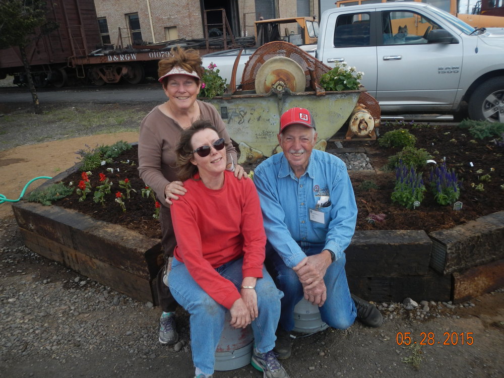 happy garden crew and finished planter.JPG