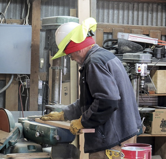 Jim Hickman is building a lean-to on the wood storage building.jpg