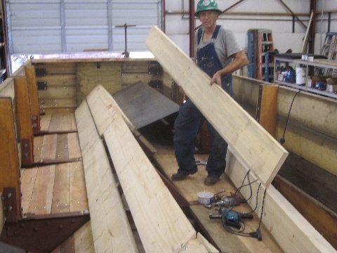 Jim Florey attaching A frame boards - notice completed left side doors.jpg