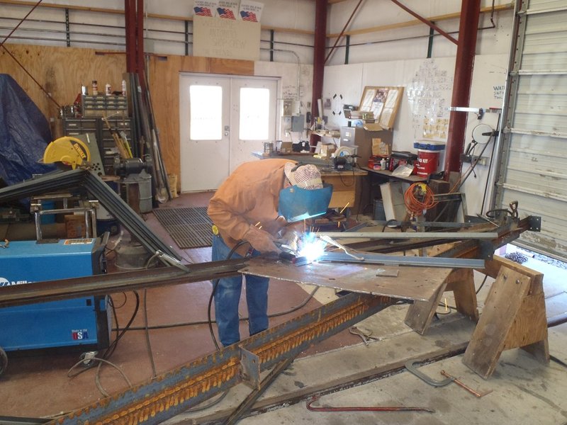 Bob Reib Continues Welding on Steel Truss for Car Shelter.jpg
