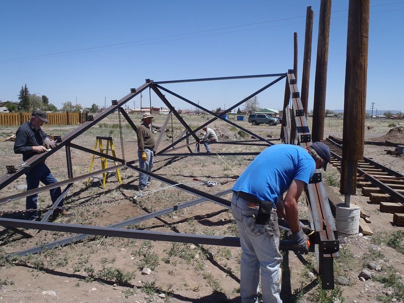 Rod Whelan, George Davies, Russ Hanscom and Jim Kyser work to square trussses for lifting process.jpg