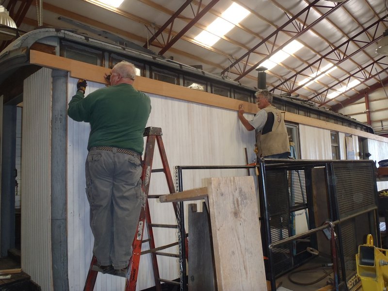 Tom Hiscox and Craig McMullen fit molding on exterior of Cook Car 053.jpg