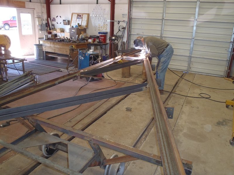Marshall Smith welding trusses for Car Shelter.jpg