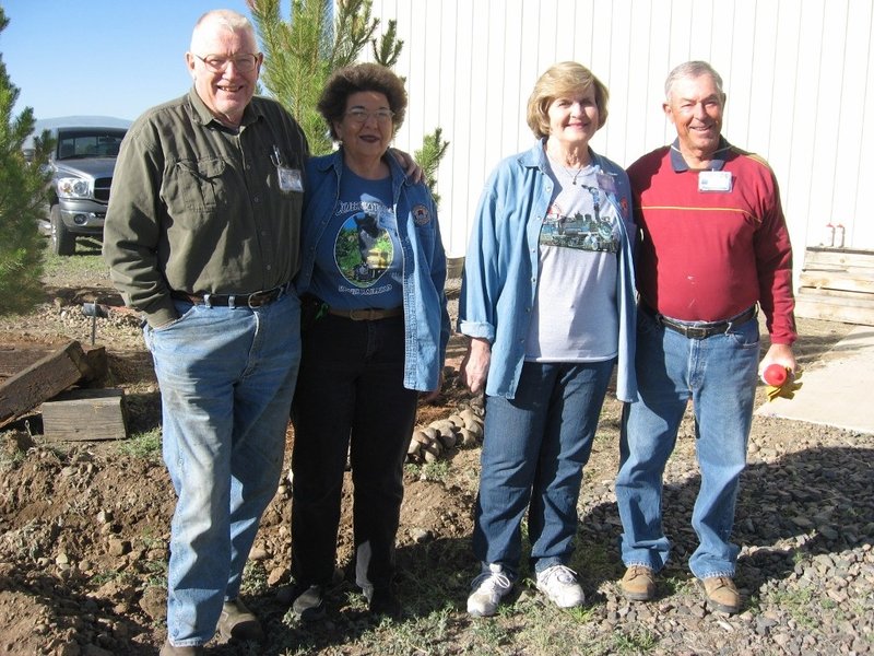 Marshall and Mary Jane Smith (15 years), Linda Smith (10 years) and George Davies 15 years) get service pins.jpg