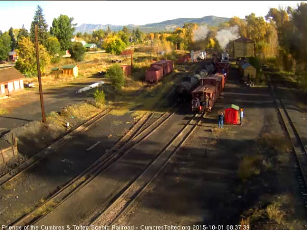 10.1.15 The derrick extra passes Larry G as it leaves Chama.jpg