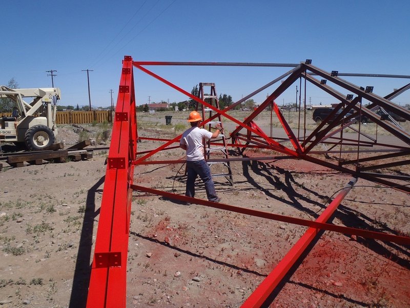 Chase Kepner spray paints a truss pair.jpg