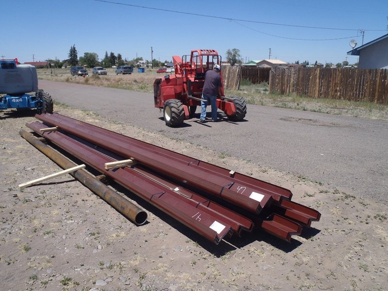 Steel purlins (horizontal structure members) for the trusses - about half of what is required (total cost, $15,000).jpg