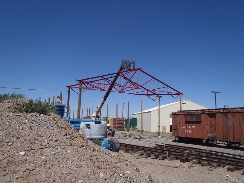Mike O'Nele operates equipment lifting truss in place.jpg