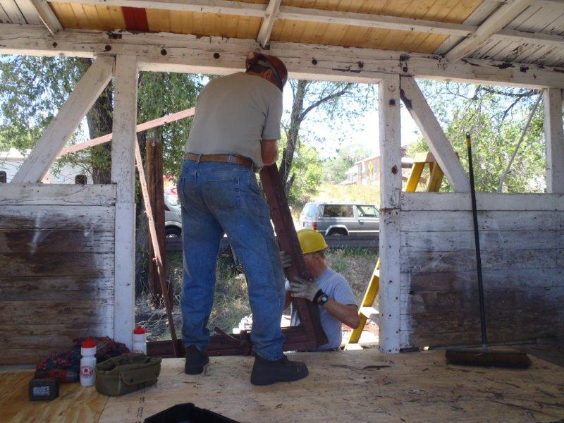 Team Leader Craig McMullen and Carl Olsen remove door frame in new tool car.png