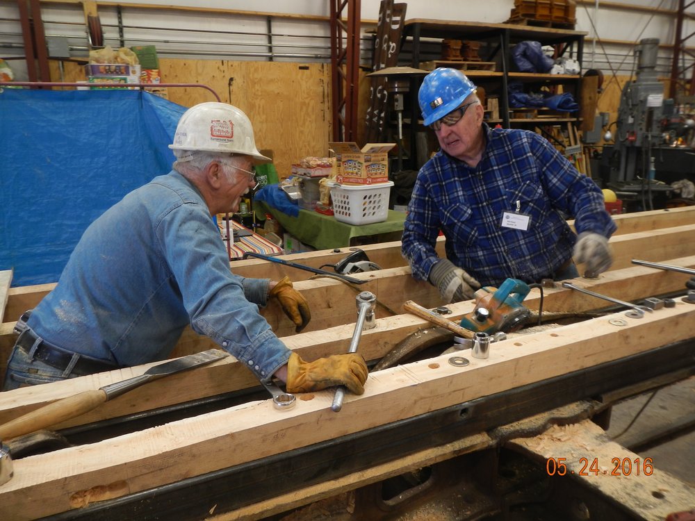 chuck and sam begin tightening down the center sills.jpg