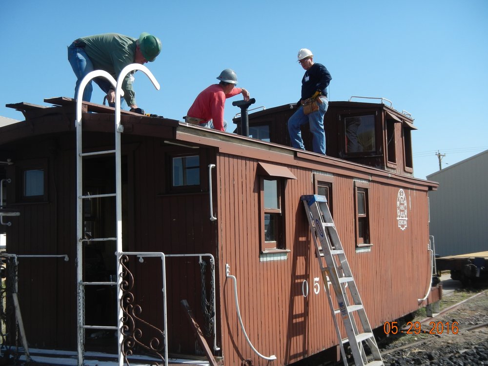 Repairs continue on Tully caboose.jpg