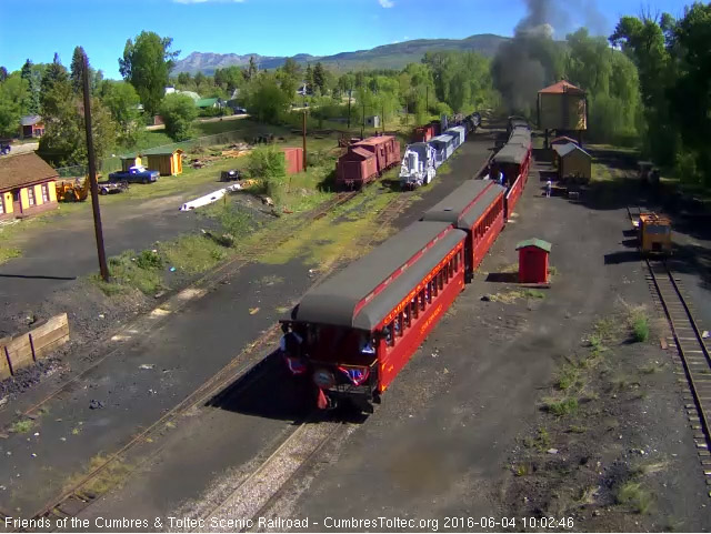 6.4.16 The conductor leans out from the platform of the parlor Colorado checking his train.jpg