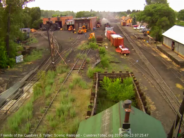 6.23.16 489 shoves the caboose and spreader ahead to the water car.jpg