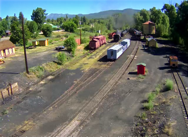 7.9.16 The Colorado is passing the water tower as a small child runs after the train.jpg