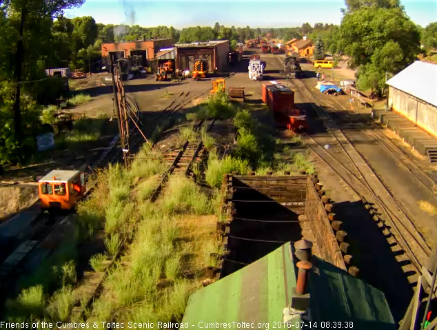 7.14.16 Now 487 shoves 463 into the west stall, 489 is waiting its road crew and the speeder back toward the water trailer.jpg